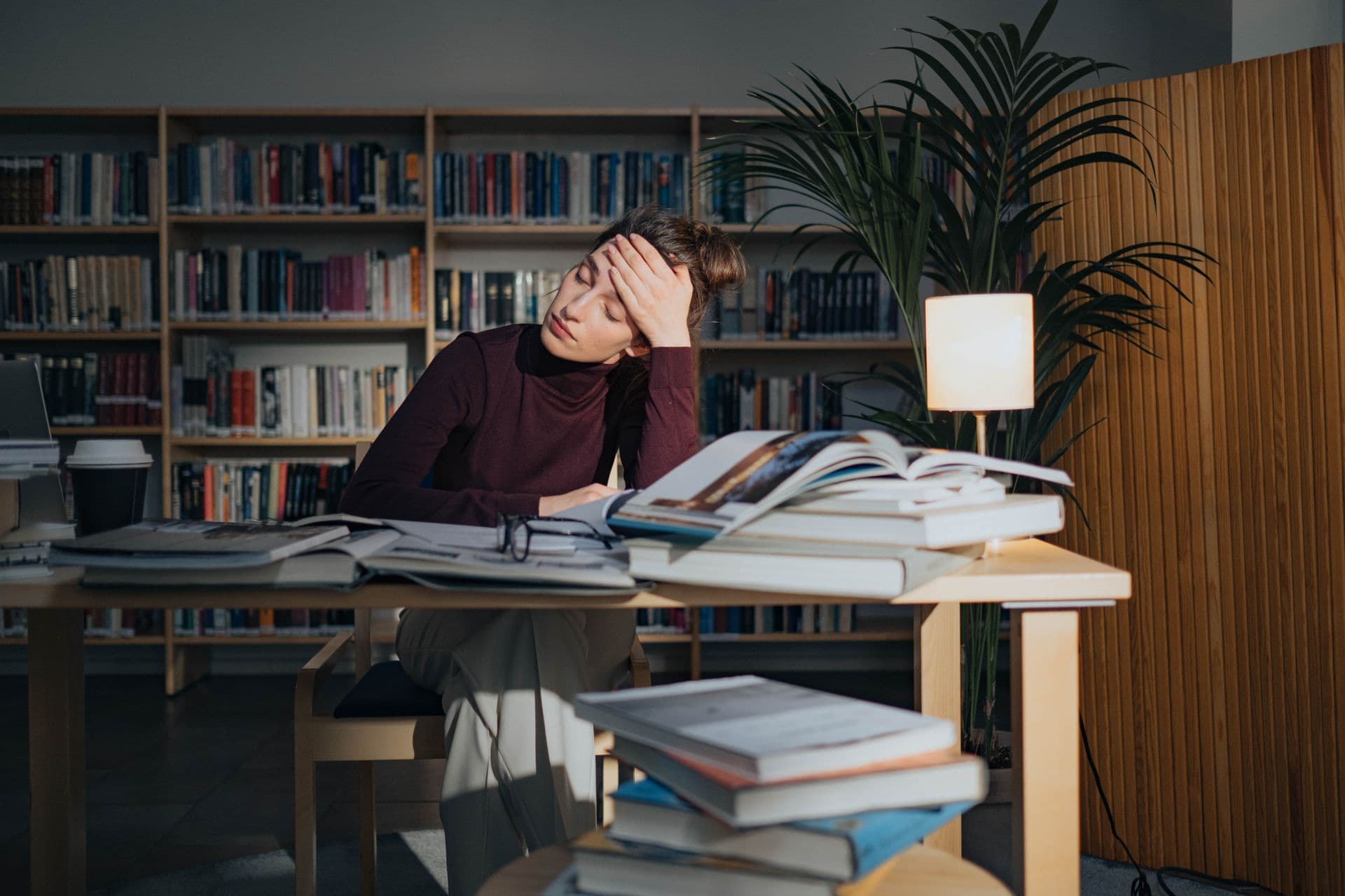 A maker overwhelmed by paper notes and spreadsheets